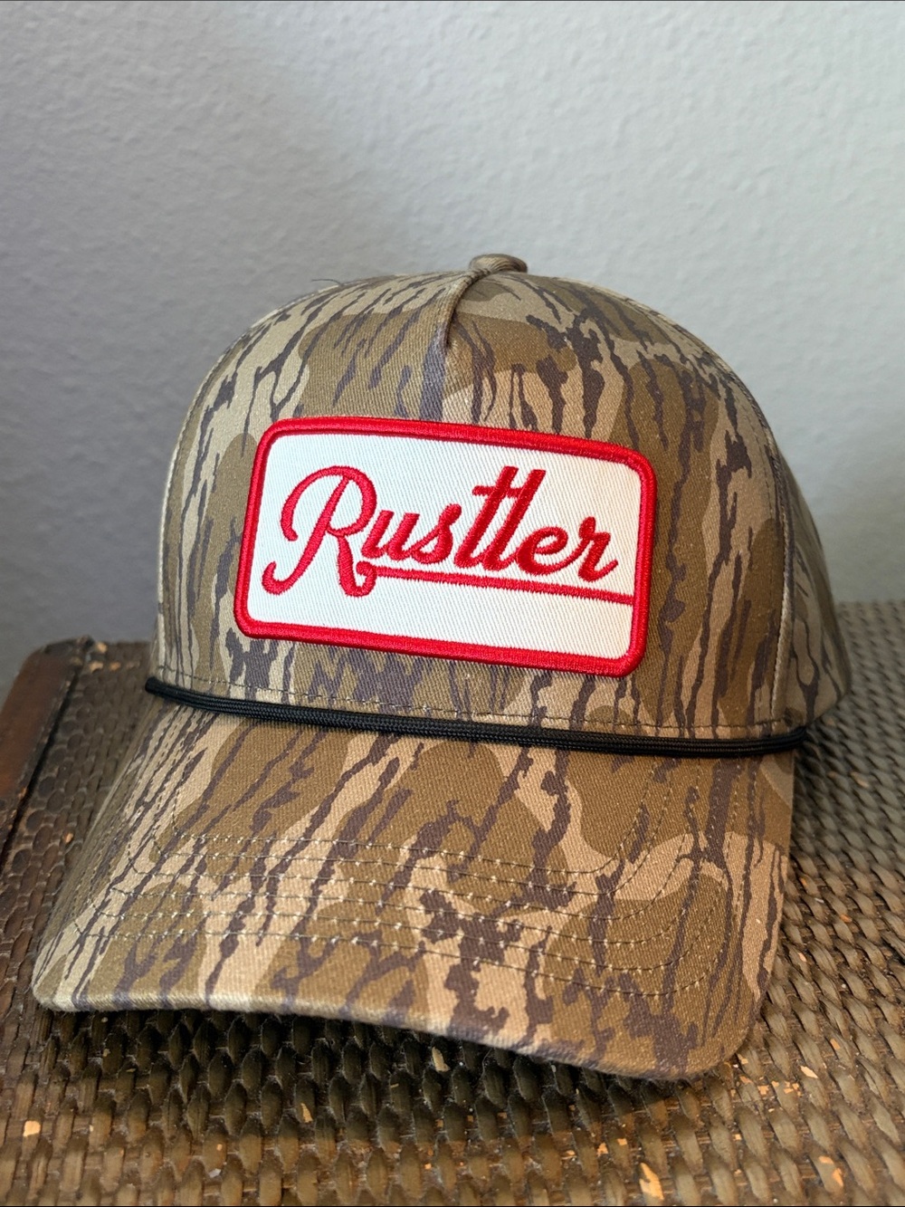 Rustler Tan Camo Trucker Hat with White and Red Patch